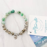 Aqua tides or beachy blues with sandy jaspers
